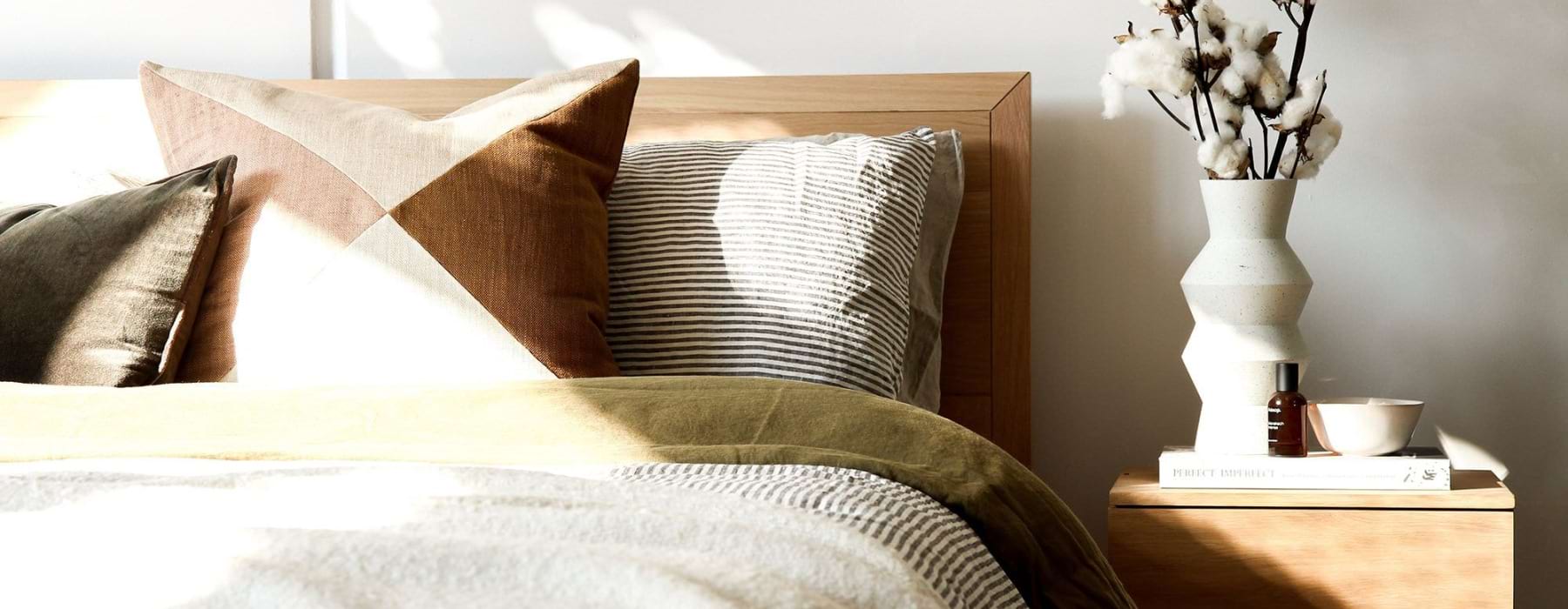 a bedroom with a bed and a nightstand